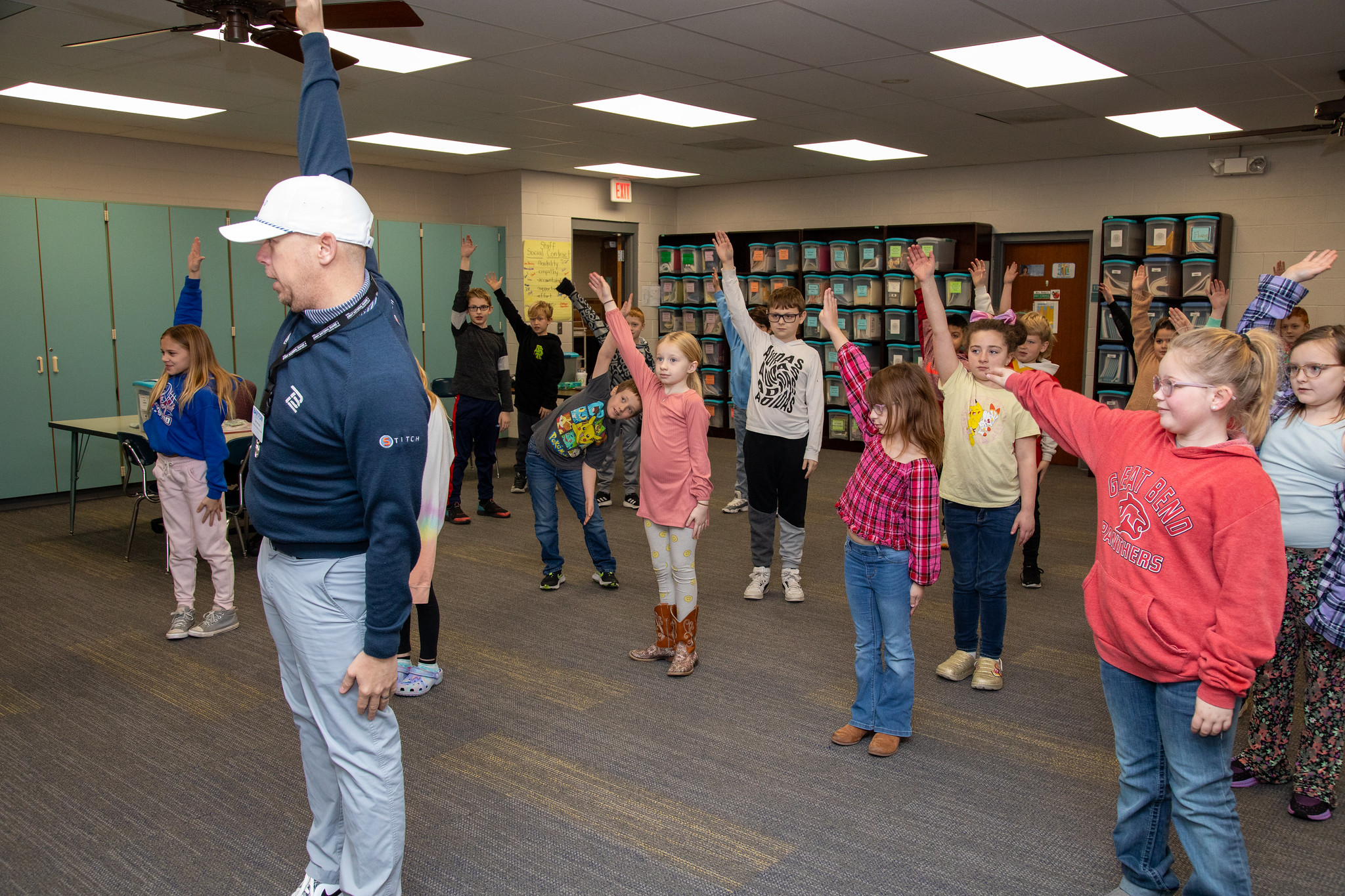 instructor shows kids how robots move