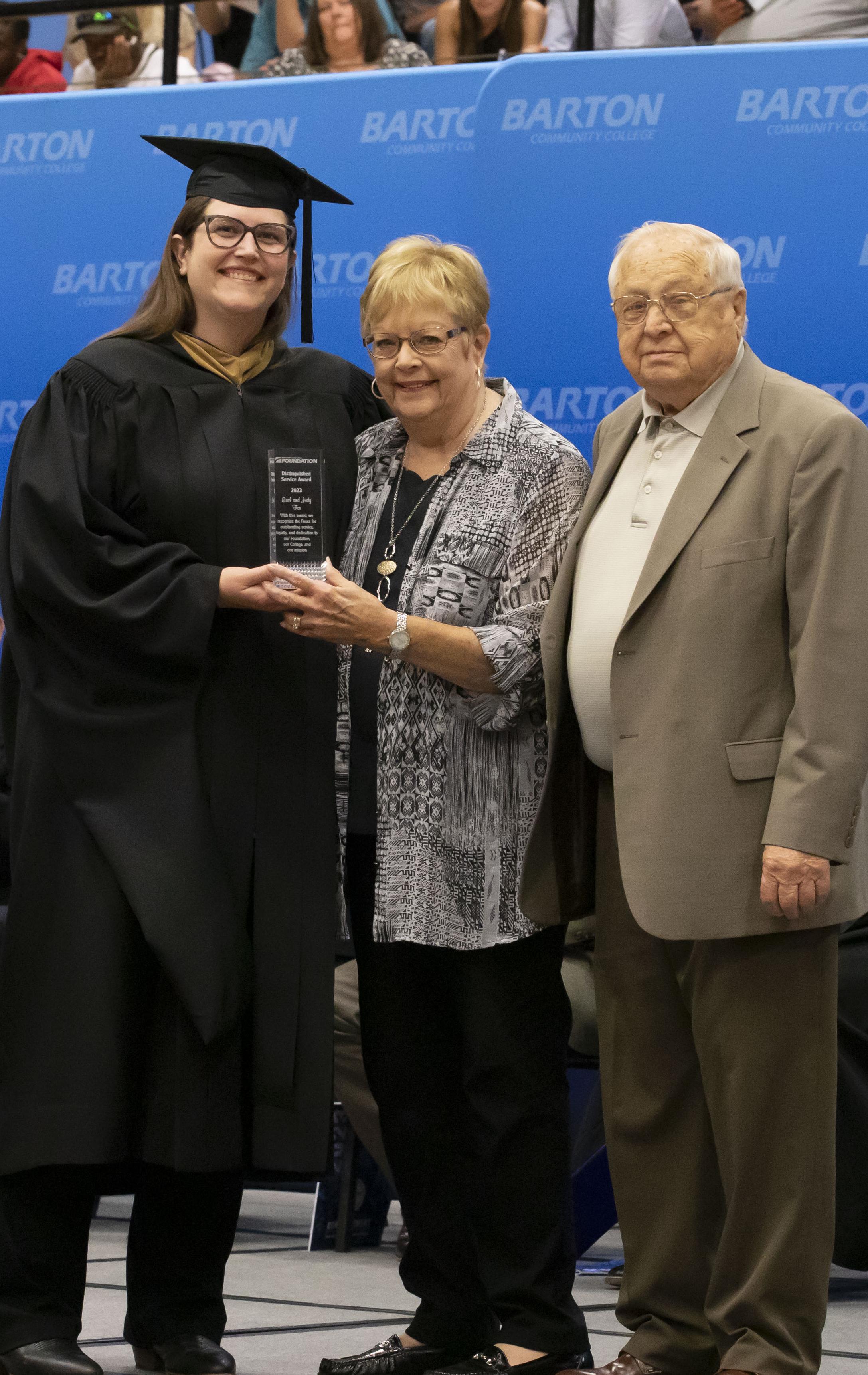 three people posing for a photo