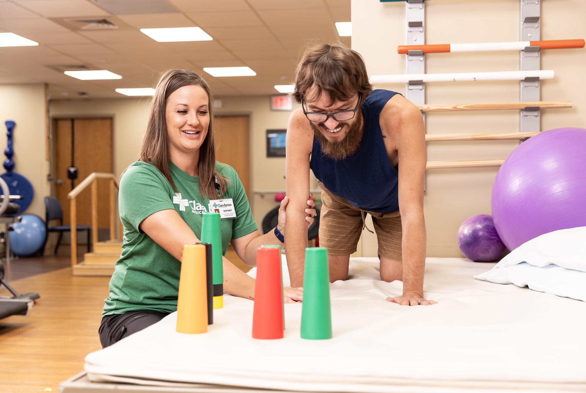 occupational therapist helps a patient